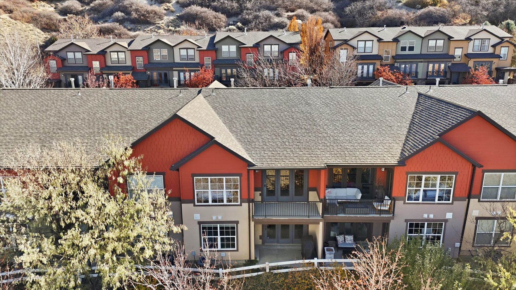Back of home with private balcony
