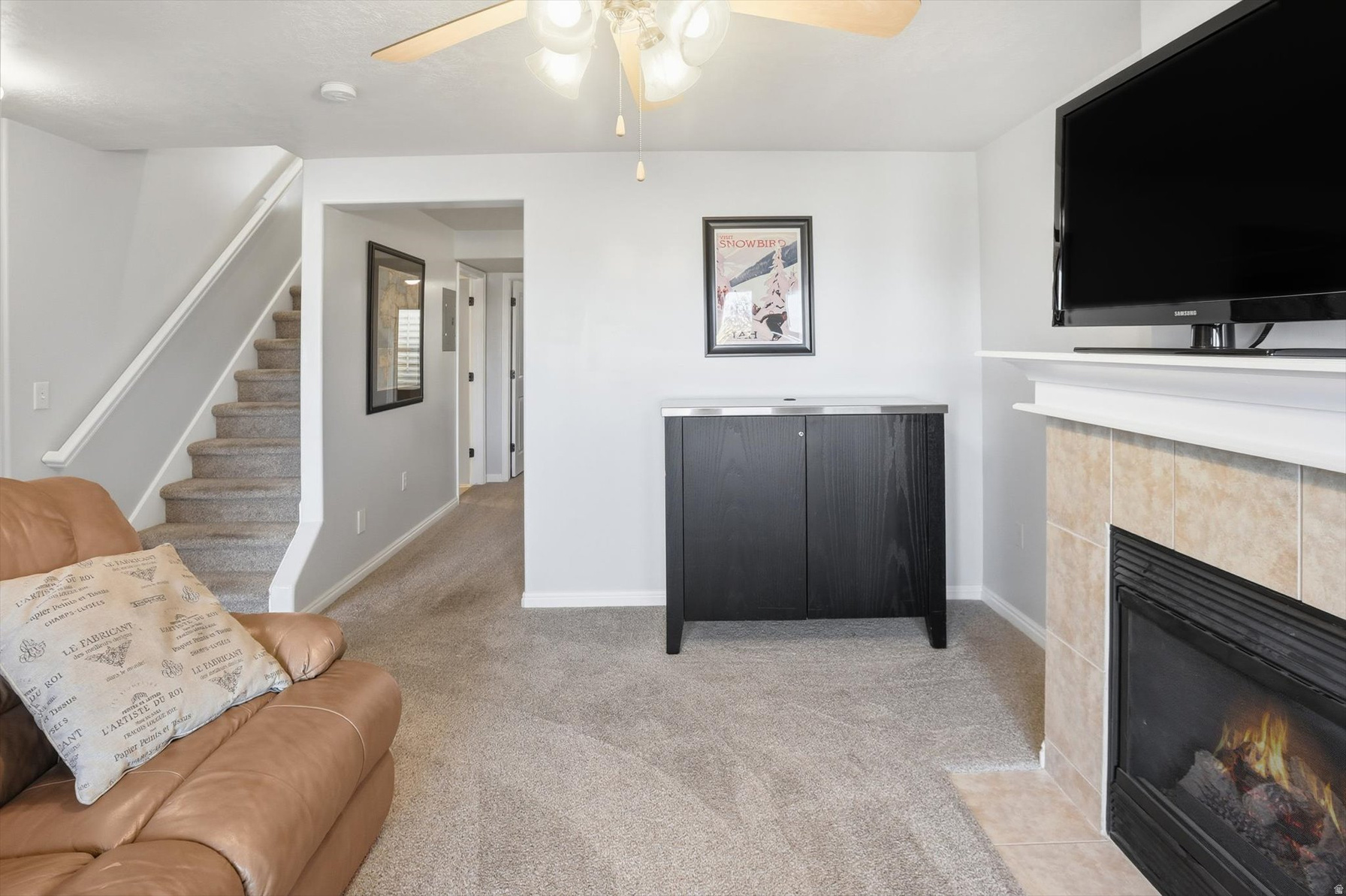 Living area with tiled fireplace